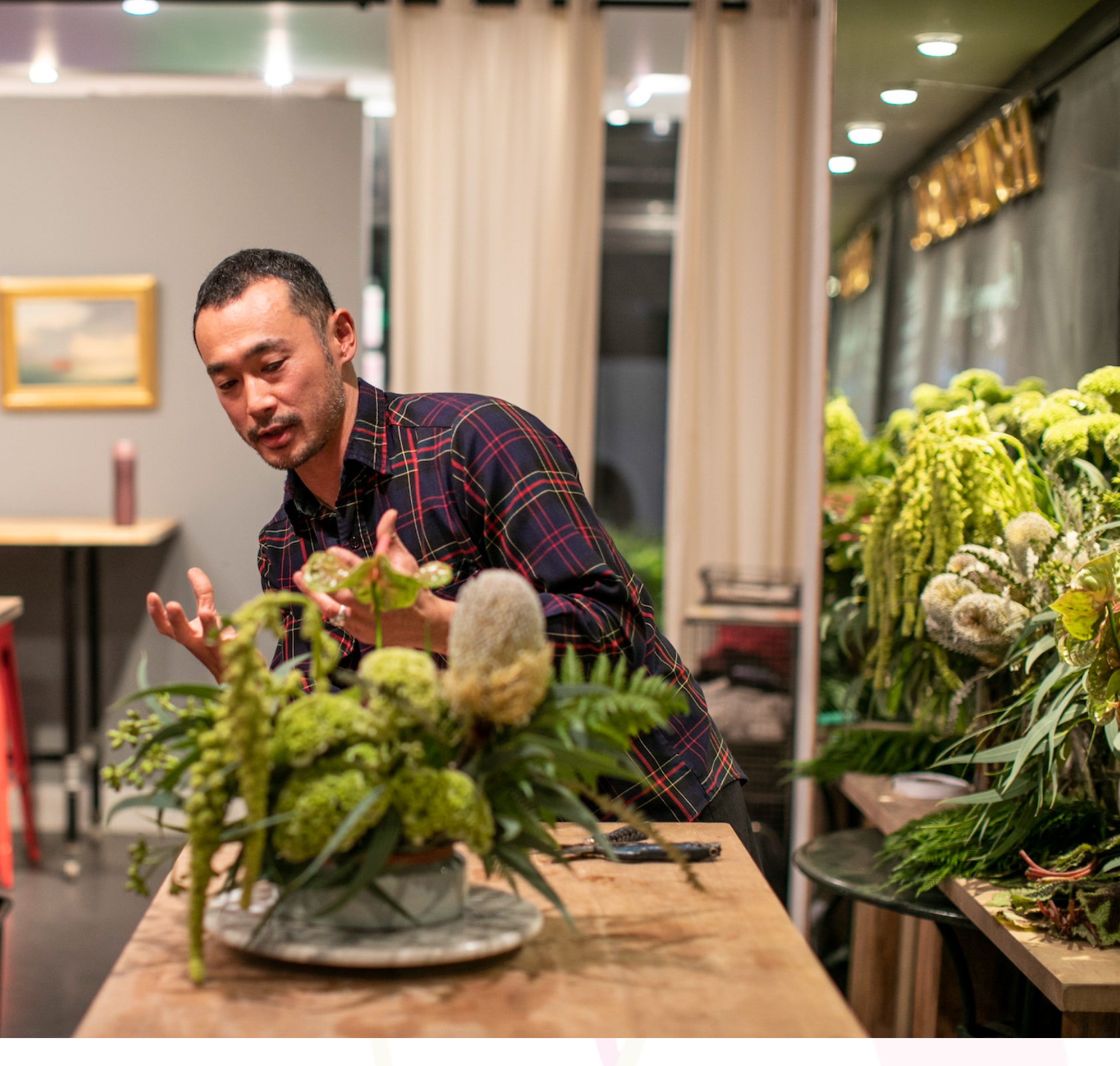 Takaya Sato teaching a floral arrangement workshop.