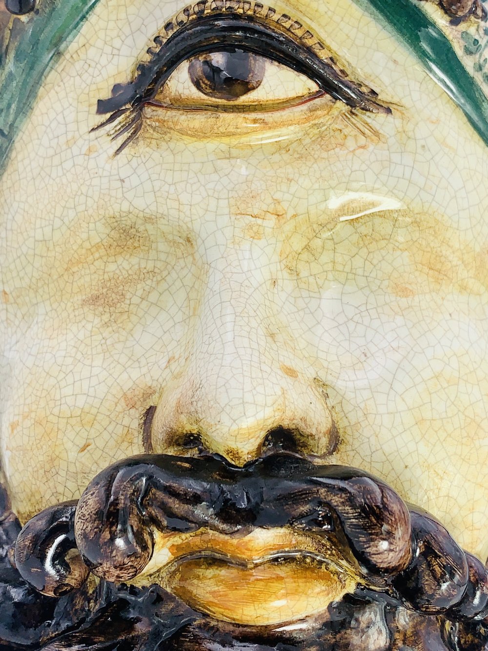 An image of a man with a Plifemo hand made vase and a beard.