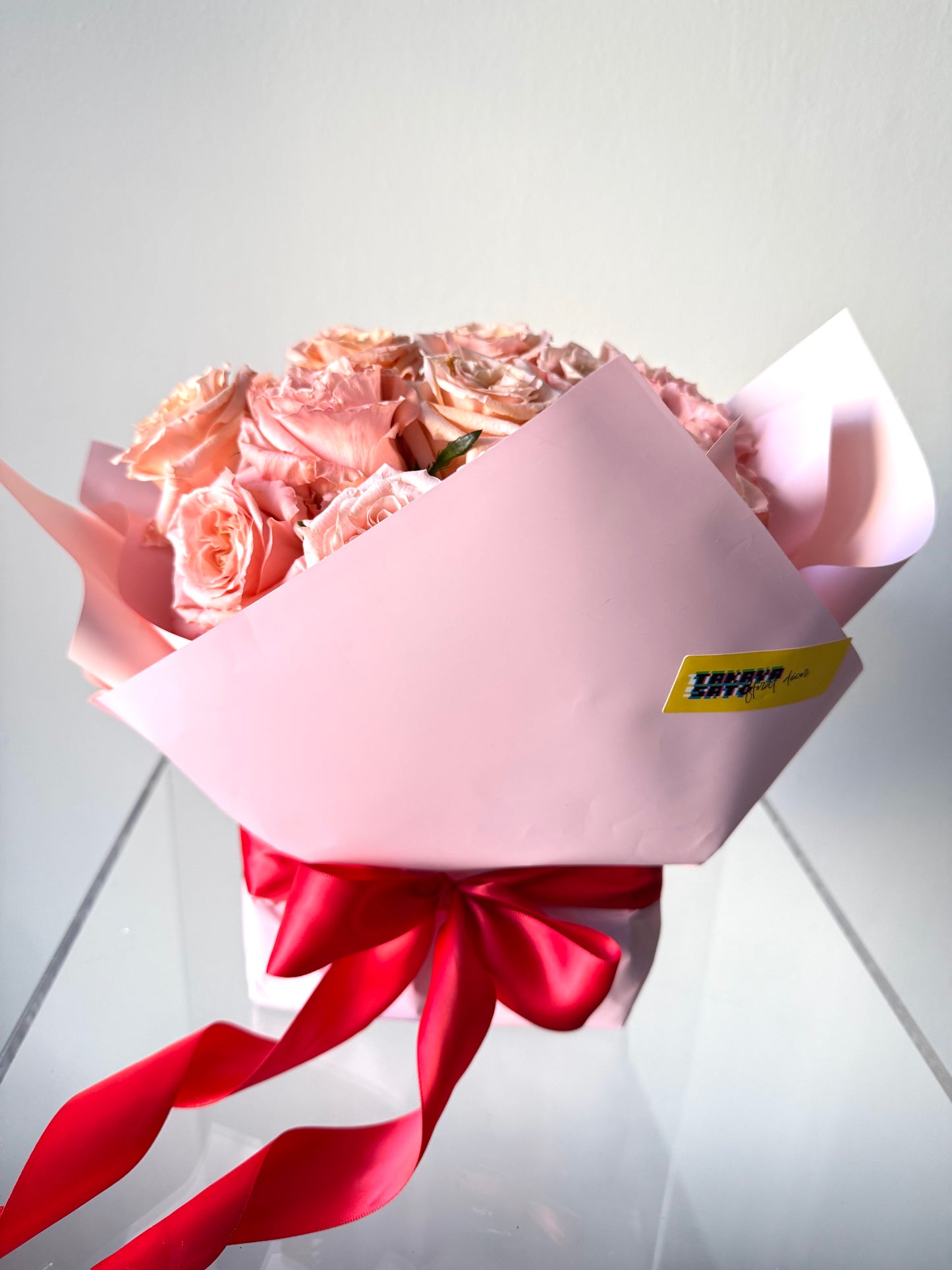 Sexy Pink Valentine’s floral arrangement in an elegant pink gift box with delicate roses and blooms