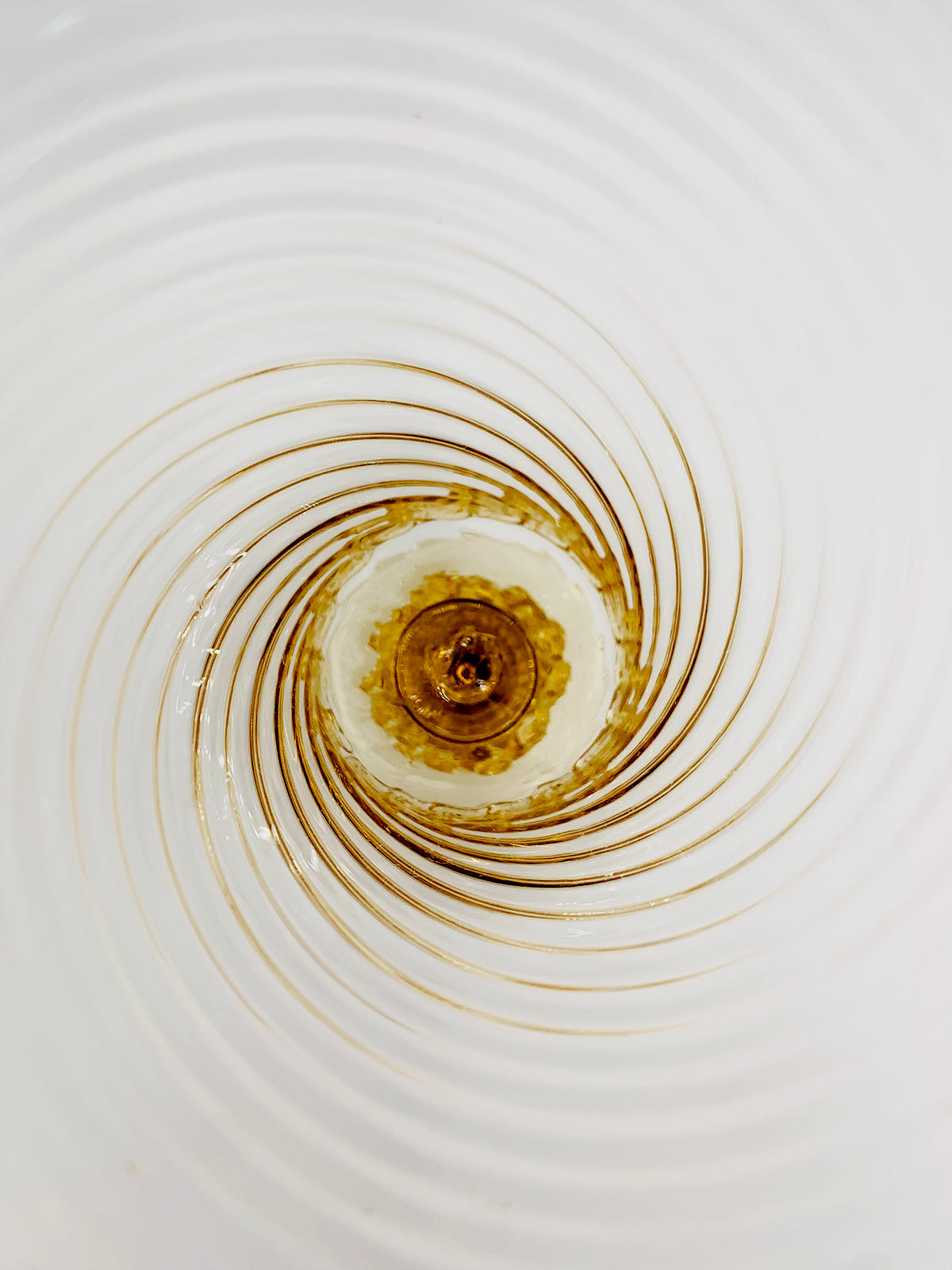 An Image Of A Spiral In A Bowl Of Water Crafted With High-Quality Craftsmanship Using Murano Bronzo By TAKAYA SATO