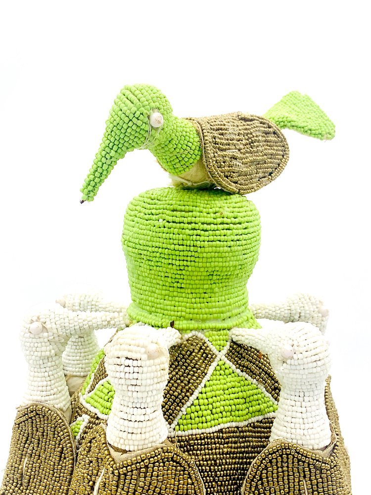 A Colorful Yoruba King Crown Beaded Africa from TAKAYASATO.COM with a turtle on top of it