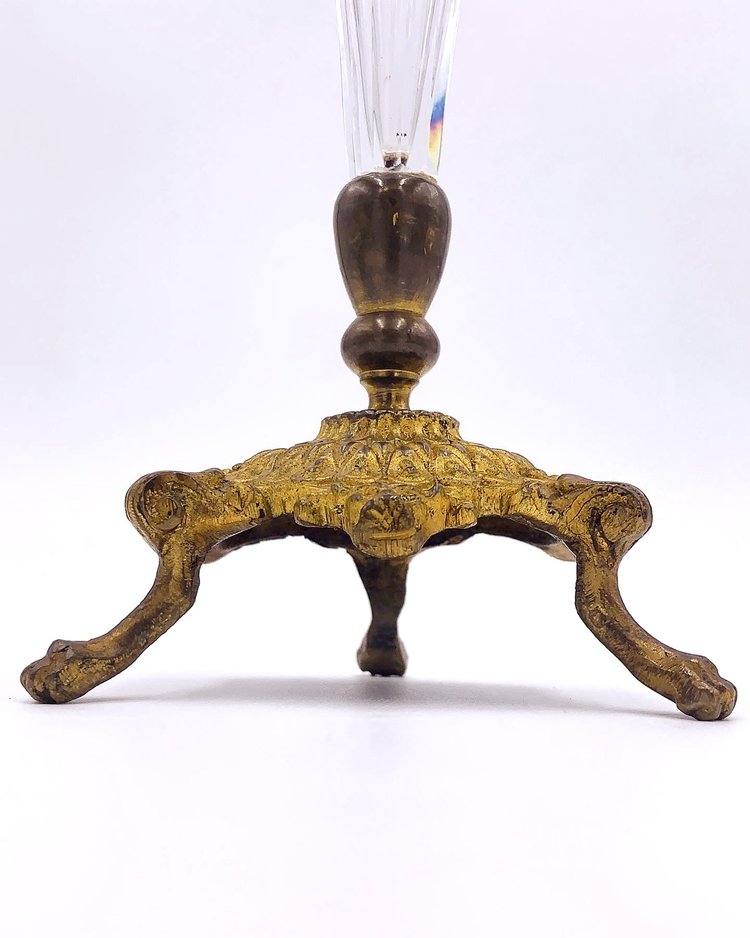 An ornate brass and crystal footed vase with a glass top from TAKAYASATO.COM.
