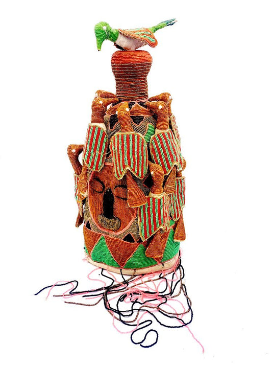 A Orange Yoruba King Crown with a bird on top of it. Beaded. Africa by TAKAYASATO.COM