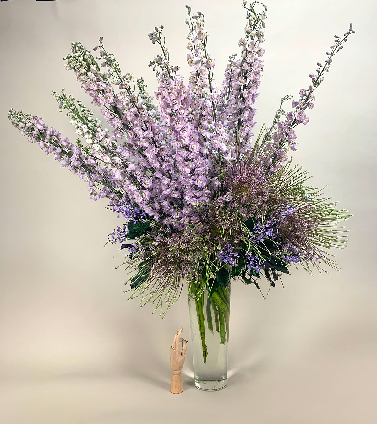 An elegant purple floral arrangement in a vase from TAKAYASATO.COM's ECCENTRIC collection.