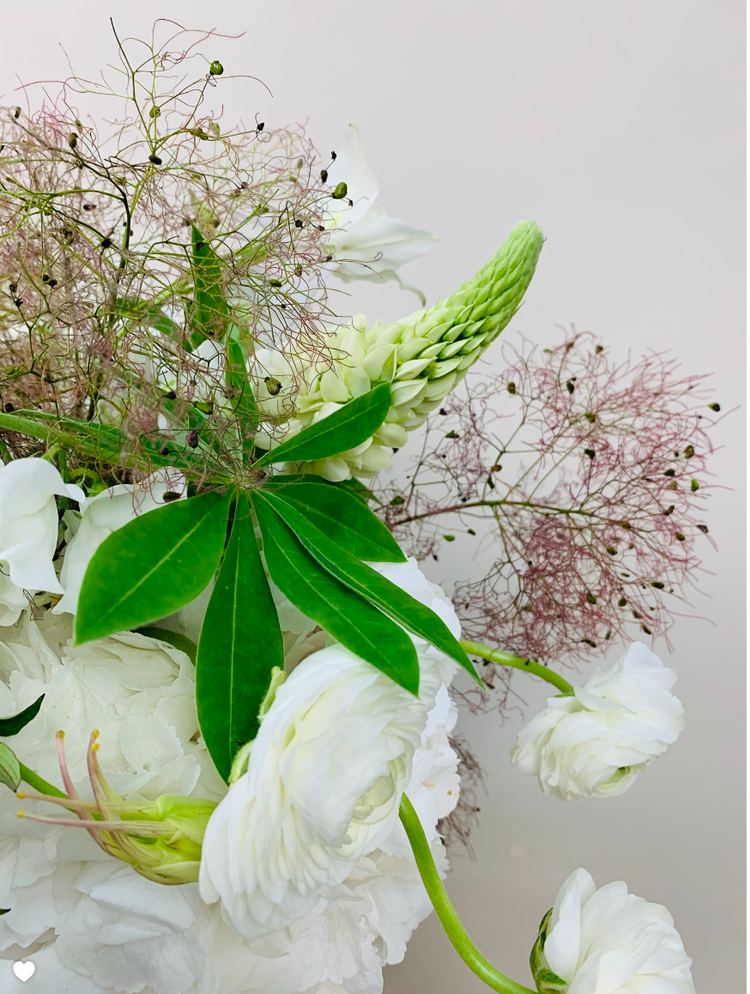 A vase with WHITE,GREEN & HERBS flowers on the table by TAKAYASATO.COM.