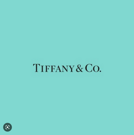 Tiffany & co logo on a turquoise background.