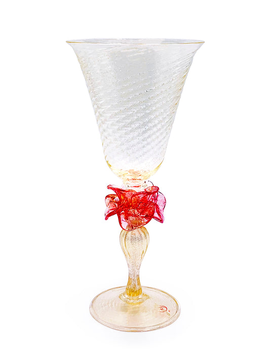 A handcrafted Murano Fiore Rubino glass with a red bow on it, made by TAKAYASATO.COM in Venice.