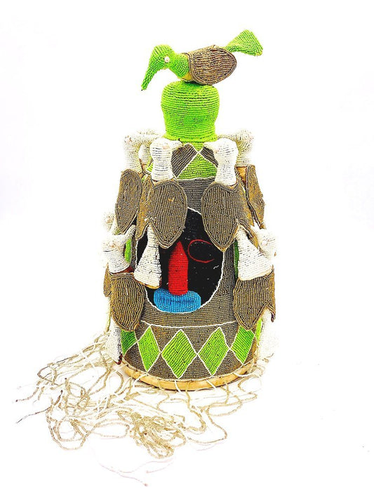 A small basket with a Colorful Yoruba King Crown. Beaded. Africa on it from TAKAYASATO.COM.