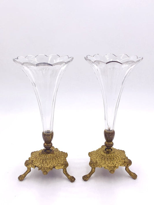 A pair of TAKAYASATO.COM brass and crystal fotted vases on a white background.